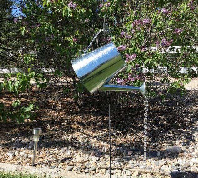 Upcycled Items For Your Yard (5) watering can decor