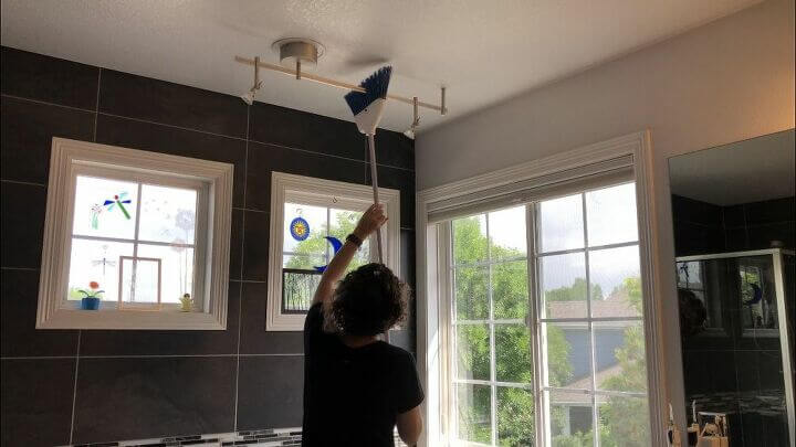 I use a broom to get rid of cobwebs in corners and on light fixtures.