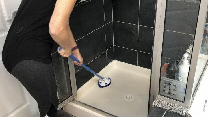 I use the extendable scrubber to clean the bottom. After it's all clean, I rinse it all off.