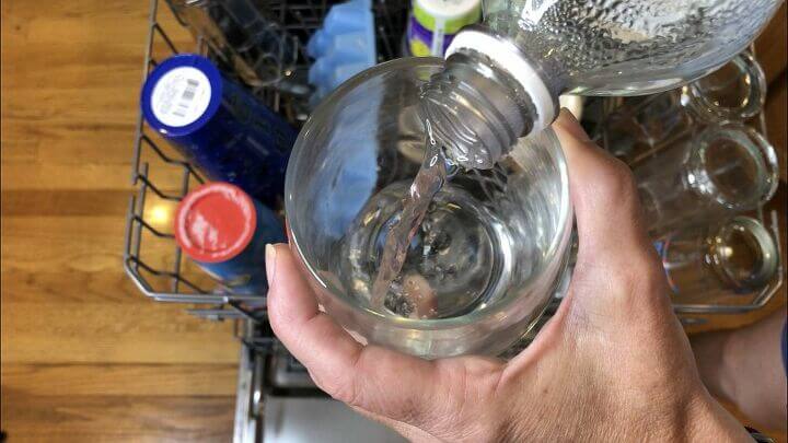 Before washing your dishes, flip one of the dirty glasses upside down and add a cup of vinegar to it.