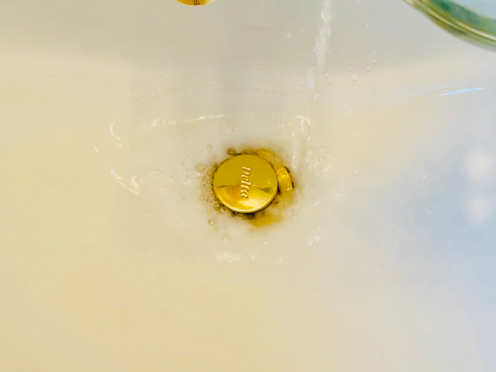 Adding vinegar to the sink drain