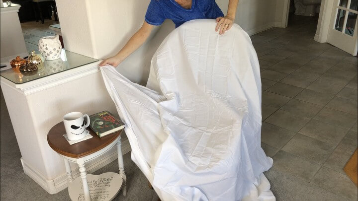 I put a full size white sheet over the top of my rocking chair.