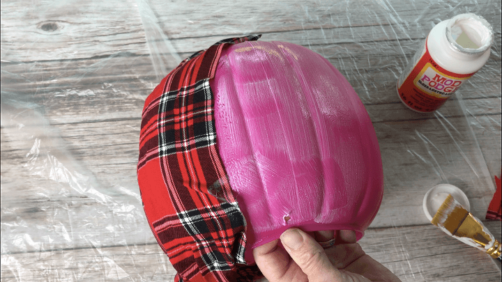 Pumpkin #5 - I painted Mod Podge onto the bucket and added strips of plaid fabric.