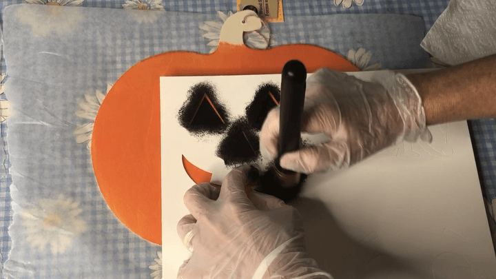 I then used my Folk Art Holiday Stencils and with some of the same chalkboard paint I stenciled on the face for my Jack O Lantern.