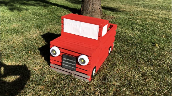 Here is the assembled truck from the front. I thought he was missing something so I added a wooden coaster that I had painted with Folk Art Chalkboard Paint. I then used chalk to make the grill. Alternatively I can write messages for the season on this as well.