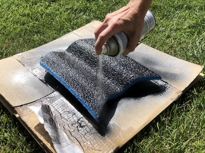 Grab a foam kickboard and paint it with black spray paint, then once that dries give it a coat of stone or concrete spray paint.