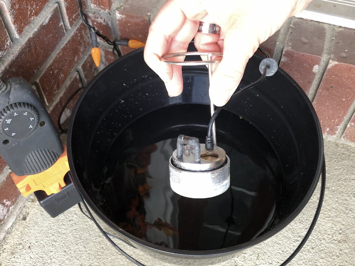 Add some water to the bottom of a plastic cauldron.  Tape the legs upside down into the cauldron.  Add an atomizer to the cauldron to create the misting effect.