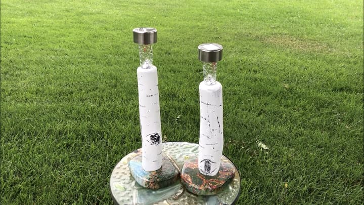 I pulled the bases off 2 dollar store solar lights and place them into the candle holders. They fit perfectly!