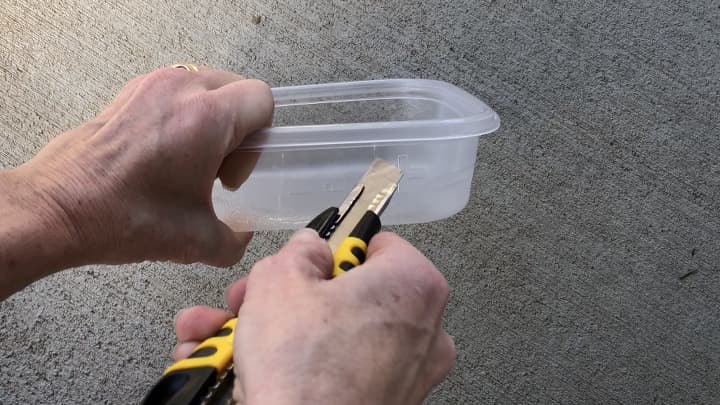 Protect your cords by cutting holes in plastic containers.