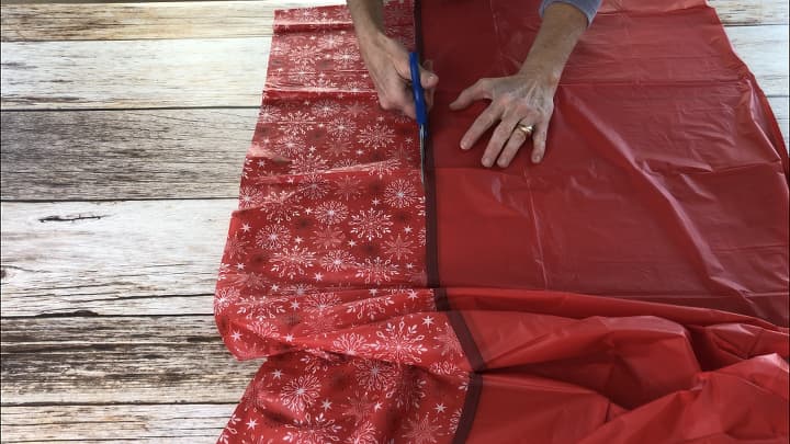 DIY Outdoor Christmas Decorations Present Door - I cut a vinyl table cloth so that I would be using the decorative pattern.