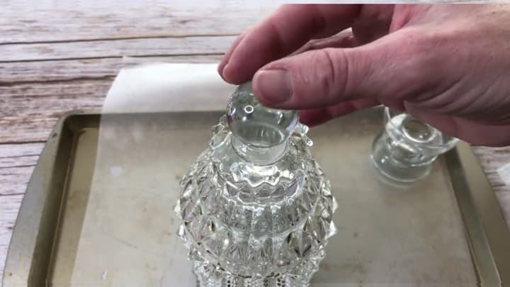 I had this glass stopper that I had saved knowing it would be good for something and this was it! I E6000 that into the top of the stacked candle holders. I let this dry for 24 hours.