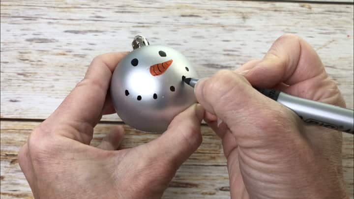 I drew a snowman face on one of the bulbs.