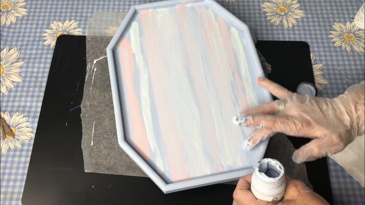 I wanted to try hand blending paint, so I added Folk Art Home Decor Chalk Paint in the colors - seaside & lilac. I dabbed on some of the paint and smeared it with my hands. You can see this better in the video with this post.