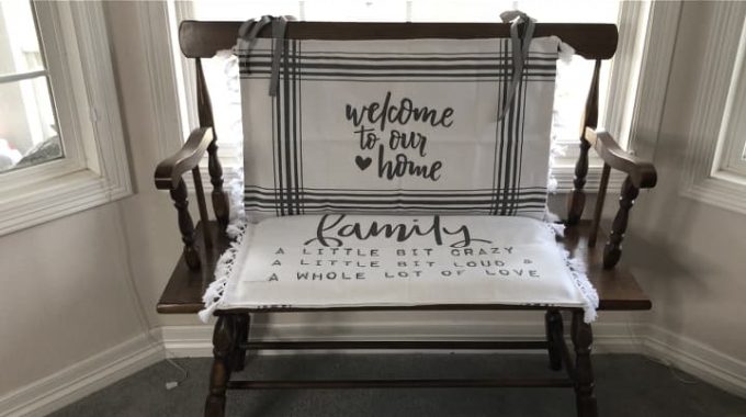 I set the first one down on the bench seat, and I tied the other cushion to the back. You can see both rug sayings I picked in this picture.