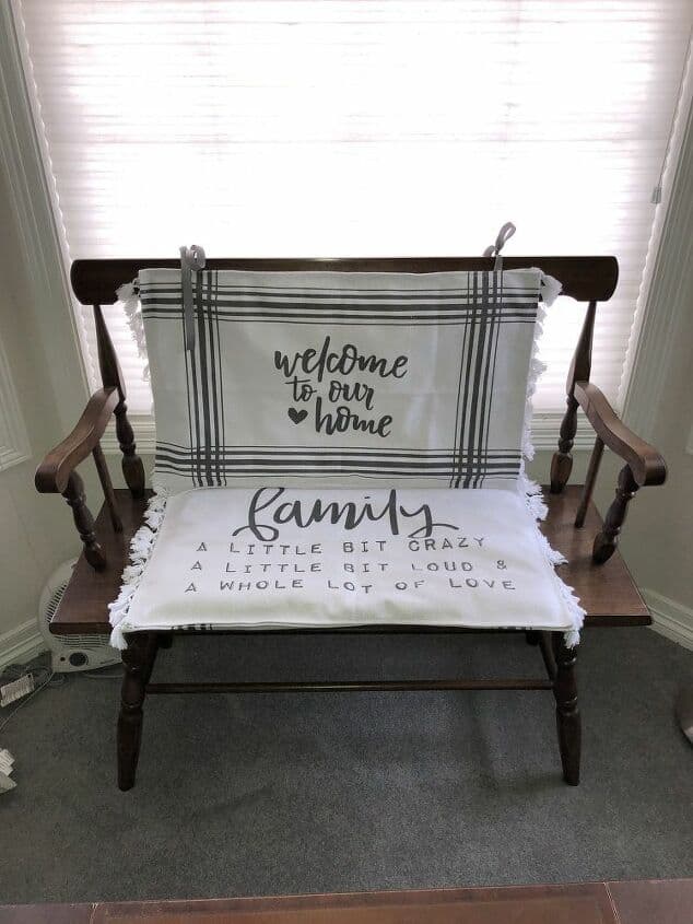 I have this old farmhouse bench I love but it's a little hard to sit on. Using rugs from the Target Dollar Spot, I was able to turn them into pillows or cushions.