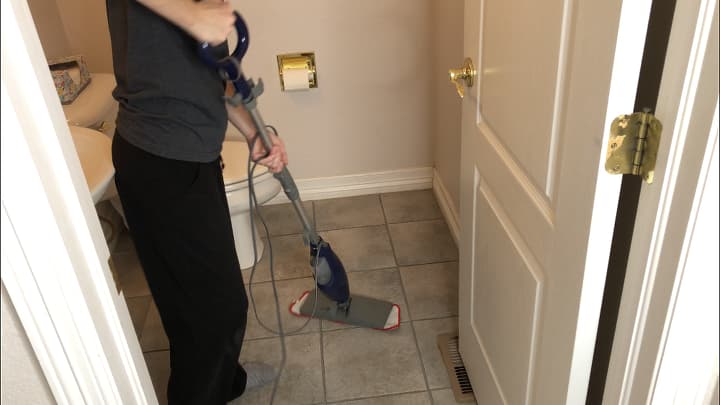 After vacuuming or sweeping, clean your floor with a steam mop. It cleans with water, and the high temperature kills germs.