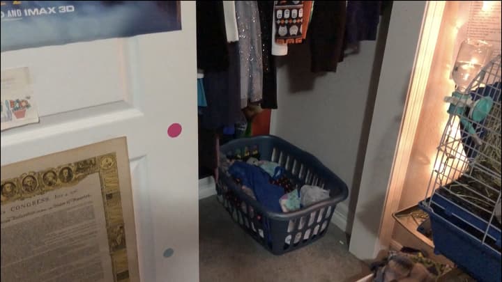 We pulled out all of her shoes and placed them in a shoe organizer that hung on the back of her door. This would free up the floor space for her laundry basket. We placed that on the long clothing side of the closet.