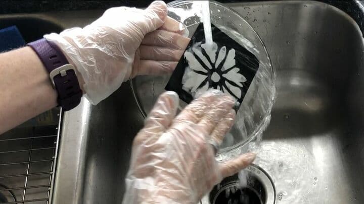 Clean It - After the time is up, rinse off the etching cream. Place the dish under running water and rub with your fingers.