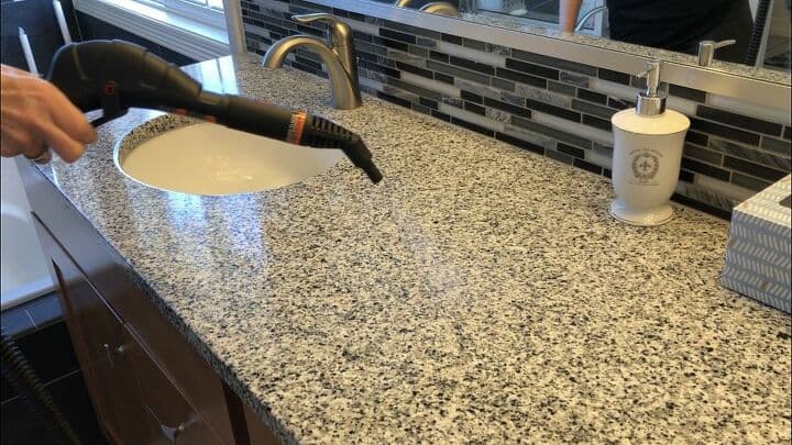 Counters, Sinks, Back Splashes, Faucets - I steamed the surfaces using the jet nozzle and wiped up with a microfiber cloth.