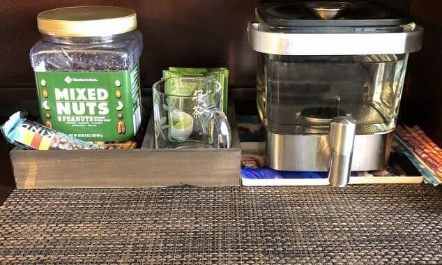 I added the snacks I wanted into my snack box and placed it in my office. I was able to add tea, a mug, a spoon, some protein bars, and nuts. I placed it next to a container holding water for my tea. I can fill my cup and place it on my mug warmer.