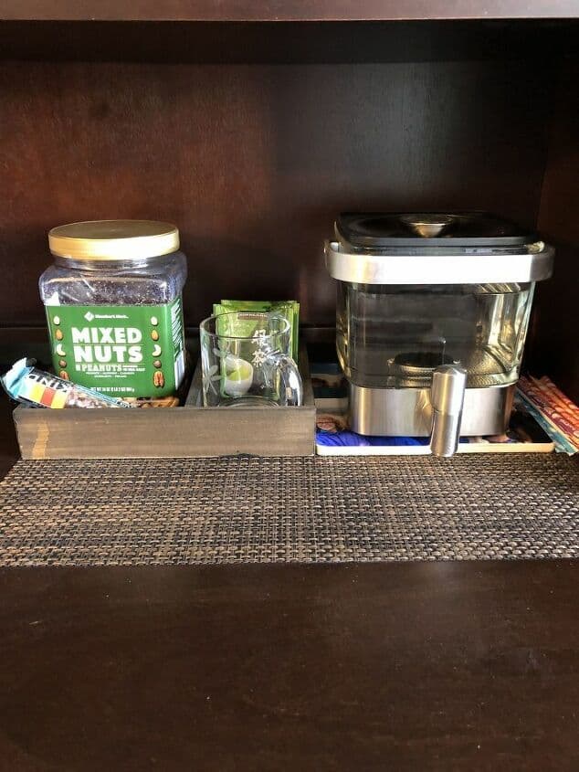 I added the snacks I wanted into my snack box and placed it in my office. I was able to add tea, a mug, a spoon, some protein bars, and nuts. I placed it next to a container holding water for my tea. I can fill my cup and place it on my mug warmer.