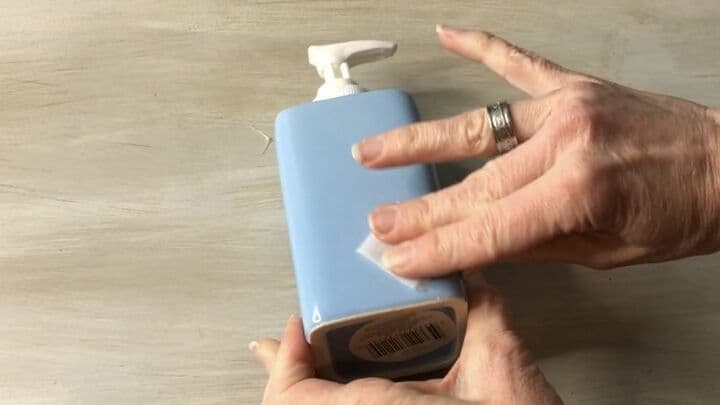Here is one of the dollar store soap dispensers. In order to stencil it, I cleaned it with rubbing alcohol. This would remove all oil, dirt, and debris.