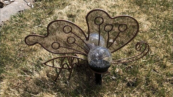 I placed my butterfly in the yard... now it reminds me of a firefly at night.