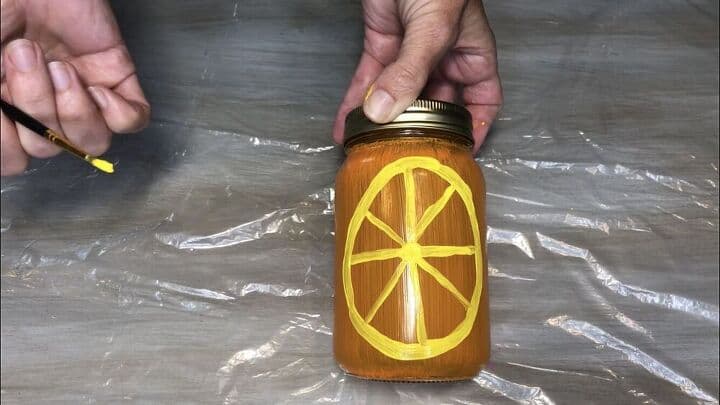 For my last jar, I was creating an orange. I used more of the Apple Barrel Multi Surface Paint in the color lemon and painted on a circle with the wedge lines.