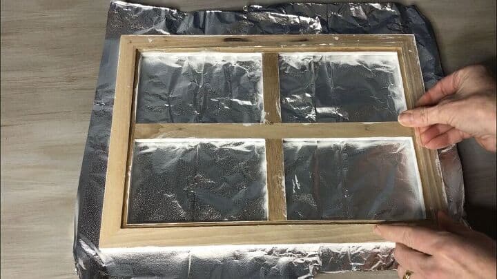 I then placed the glass piece back into the frame onto the glue.