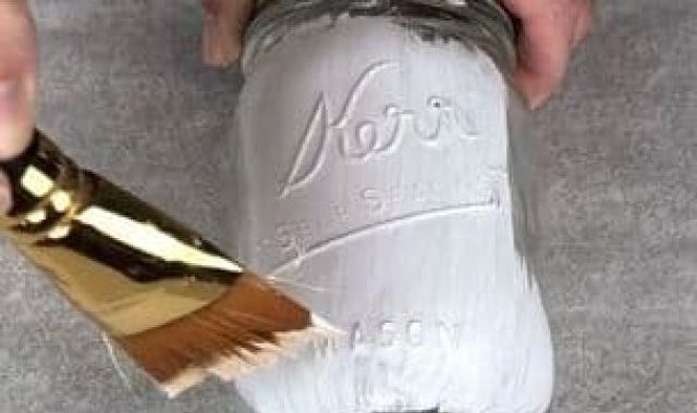 I used white Folk Art Home Decor chalk paint and painted on my first coat on all of the jars. It is important to pick a paint that says it is okay for glass. If you don't pick the right kind of paint it could peel or scratch off easy.