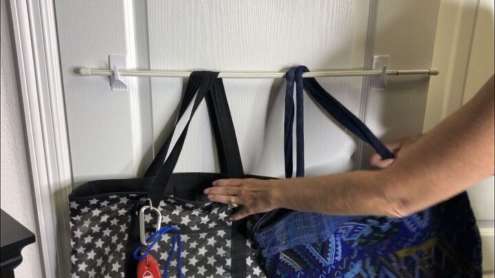 Slide bags onto a tension rod or dowel, and place into the hooks. 