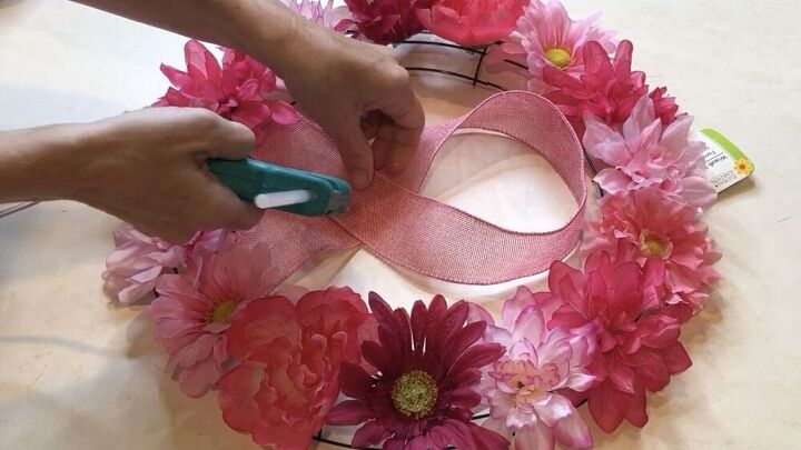 I created the breast cancer ribbon with some pink burlap ribbon. I cut it to size and I hot glued it into place.
