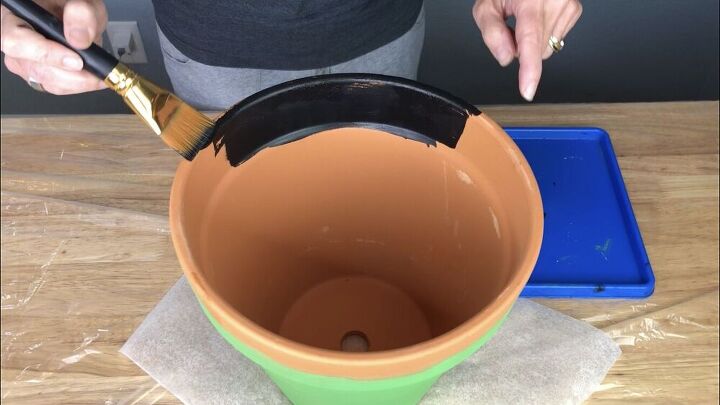 I painted the inside rim and top of the green flower pot with the black chalkboard paint.