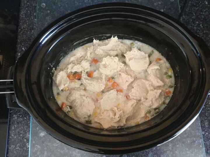 Mix baking mix and milk in separate bowl.  Drop by rounded tablespoonfuls on top of crock pot chicken mixture. 