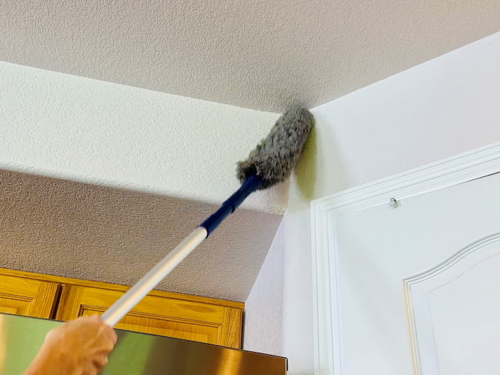Use a duster with an extension rod to reach high places. Dust all edges of windows, creases, and crevices to remove cobwebs and dirt.