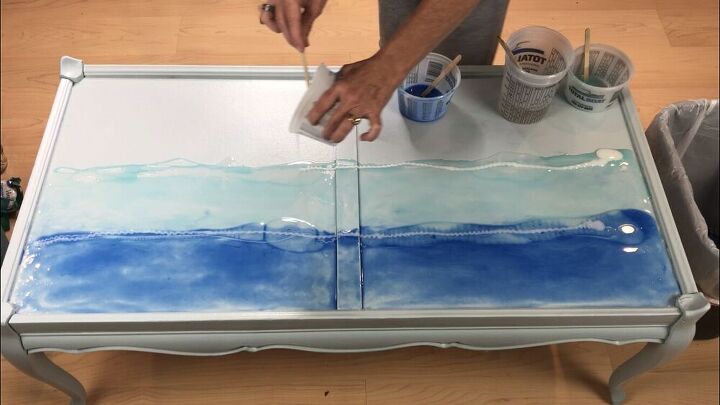 I poured a line of clear epoxy at the edge of both colors, then poured the white on top of the clear.  