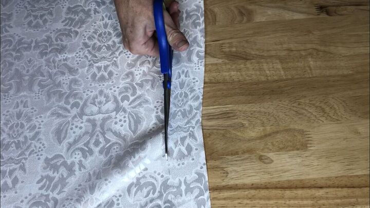 I had purchased a white table runner from Dollar Tree as well.  I cut a small strip from the runner.