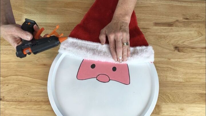I hot glued a Santa hat onto the pizza pan.