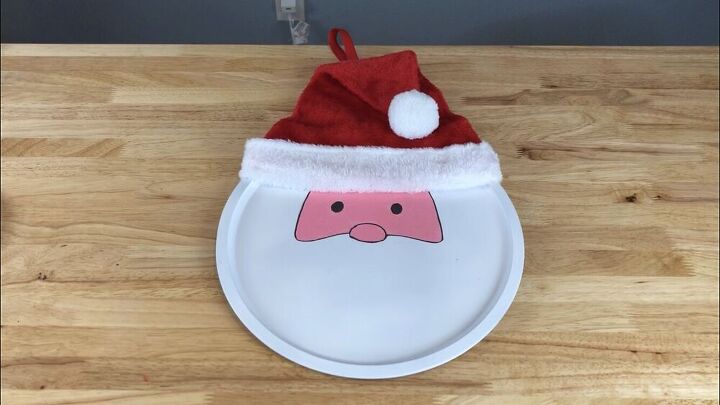I hot glued the little ball of the Santa hat onto the hat.  You can leave the pan as is, or you can add numbers to it for the kids advent calendar.
