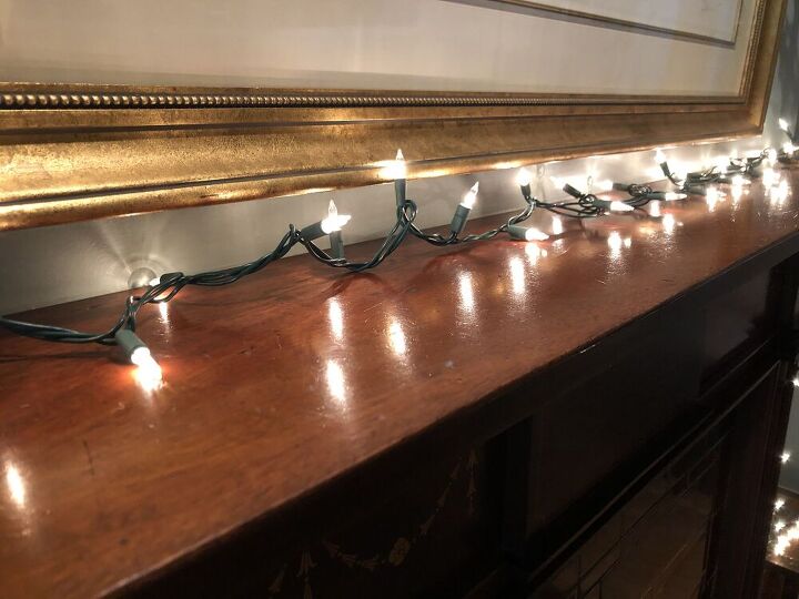 I started by laying a strand of lights across the mantel.