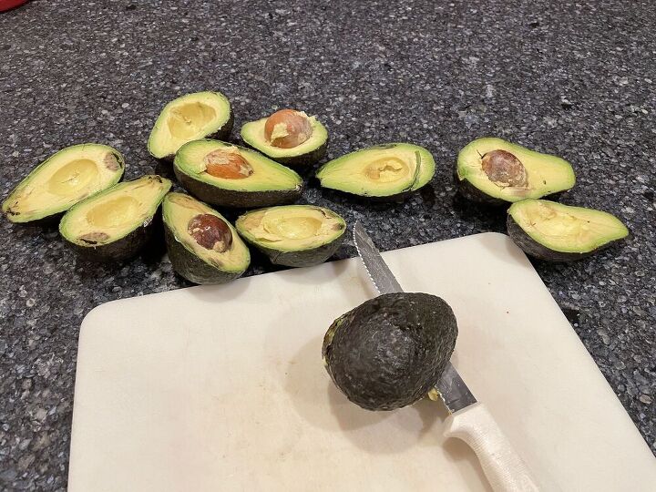 Slice the avocados in half and remove the pits.