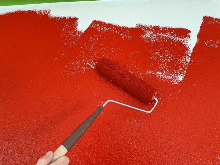 My son had picked firecracker red for part of the accent wall.  Red is his favorite color.  My husband rolled it on while I painted the edges.