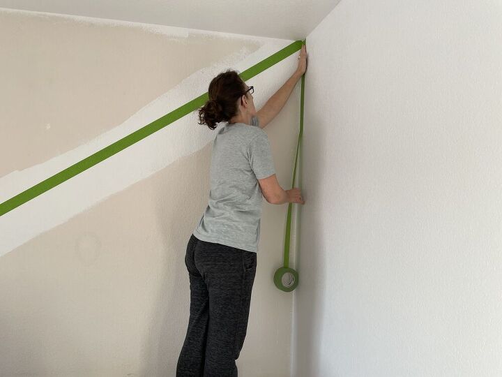 On the second day, we were ready to tackle our accent wall.  I used Frog tape to tape the edges and the diagonal line.