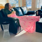 Chas sitting by the side table she just made