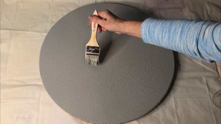 I painted the surface of the table with Folk Art Home Decor Chalk Paint in the color Silver Shadow.  I gave it one coat, let that dry completely, and then gave it a second coat.