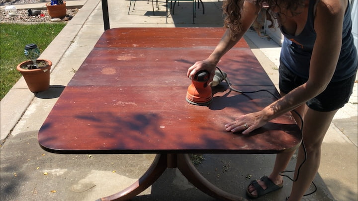 I started by sanding the dining table lightly with my Black and Decker Orbital Sander.