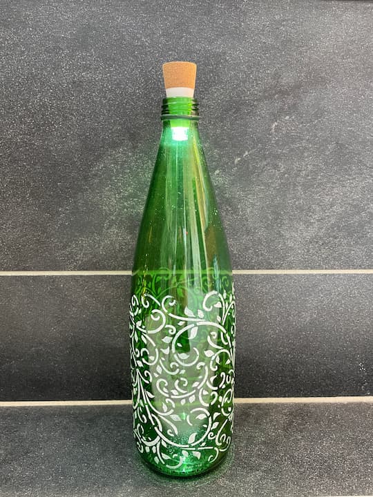 What can you do with glass bottles? Upcycle them with bottle painting and there are so many ways to use the bottle.