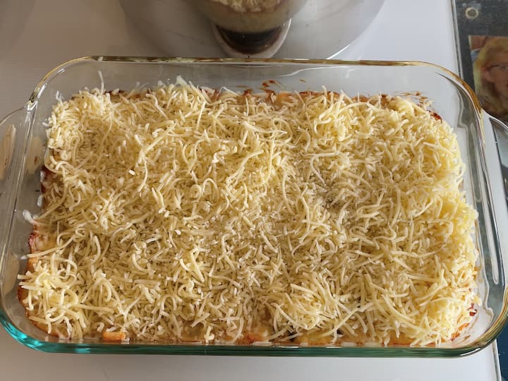 Pull out of the oven, top with our shredded cheese, and place back in the oven. Bake until the chees has melted.