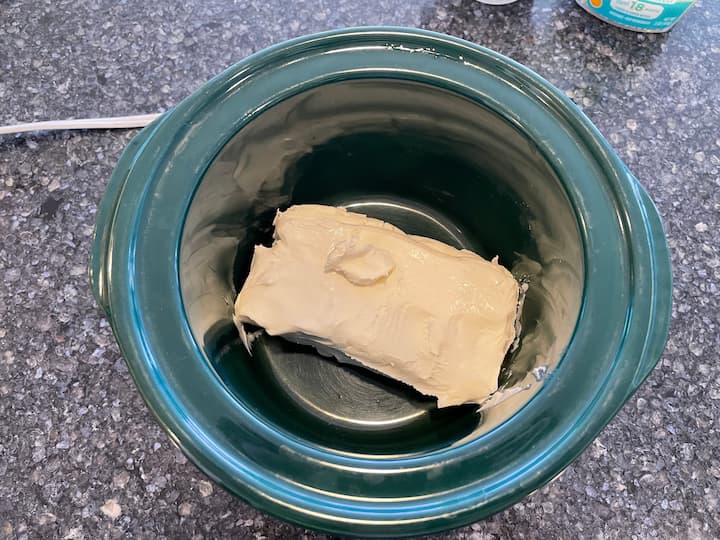 I placed 8 ounces of cream cheese in our mini crock pot.