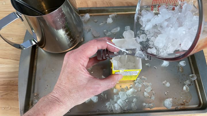 Once the wax was melted, I placed crushed ice into the carton.  If you didn't want to make an ice candle you could skip this step.  I will tell you I used too much ice and it made the candle a little crumbly.